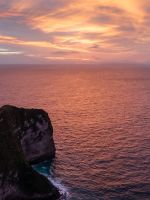 dinosaur shaped island beside sea wallpaper