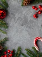 flat lay photography of pine cones candy cane gree... wallpaper